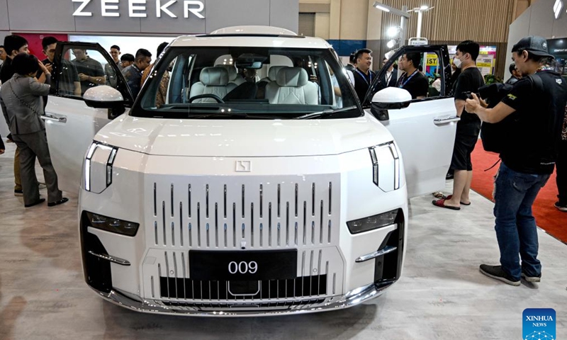 Visitors view a vehicle displayed at the booth of Chinese auto brand Zeeker during opening of Gaikindo Jakarta Auto Week (GJAW) 2024 in Tangerang, Banten Province, Indonesia, Nov. 22, 2024. The auto show is held here from Nov. 22 to Dec. 1. (Xinhua/Agung Kuncahya B.)

