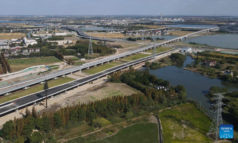 An aerial drone photo taken in Suzhou, east China's Jiangsu Province on Nov. 23, 2024 shows a bullet train running on a new high-speed rail line connecting Shanghai Municipality with the provinces of Jiangsu and Zhejiang in east China. (Photo: Xinhua)