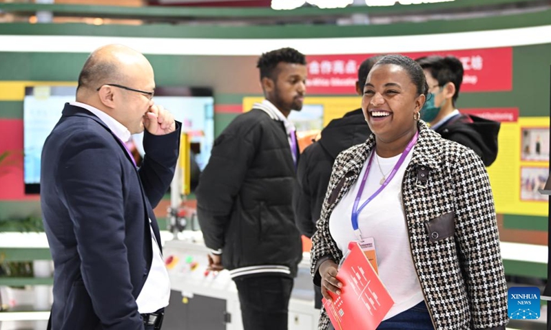 Kalkidan (R) talks with a teacher at the 2024 World Vocational and Technical Education Development Conference in Tianjin, north China, Nov. 21, 2024. (Photo: Xinhua)