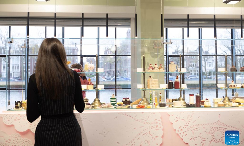 People are seen during a press preview of the exhibition Grand Dessert - The History of Dessert at the Kunstmuseum in The Hague, the Netherlands, on Nov. 22, 2024. Showcasing a rich array of desserts through centuries of culinary culture, the exhibition will be open to the general public from Nov. 23, 2024 to April 6, 2025. (Photo by Sylvia Lederer/Xinhua)