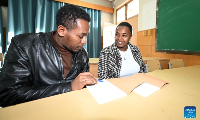 Kalkidan (R) talks with her schoolmate about a Chinese class at the Tianjin University of Technology and Education in Tianjin, north China, Nov. 21, 2024. (Photo: Xinhua)