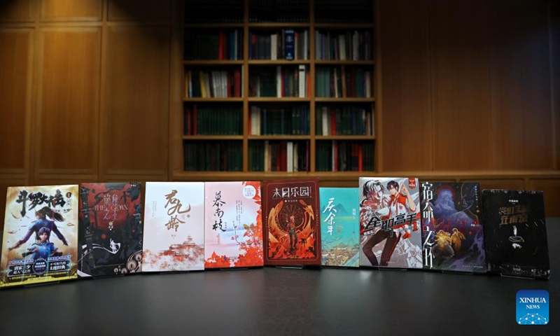 This photo taken on Nov. 21, 2024 shows some hard copies of online Chinese novels during their inclusion event at the British Library in London, Britain. (Xinhua/Li Ying)