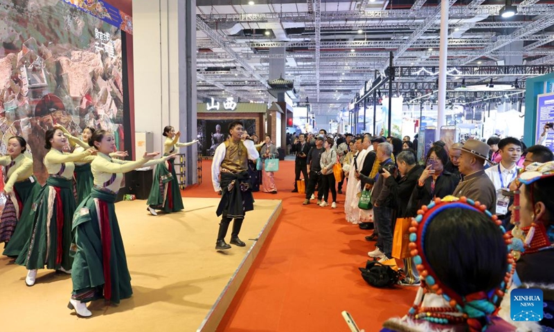 Visitors watch performances during the China International Travel Mart 2024 in east China's Shanghai, Nov. 22, 2024. (Photo: Xinhua)