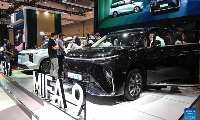 Visitors view vehicles displayed at the booth of Chinese auto brand Maxus during opening of Gaikindo Jakarta Auto Week (GJAW) 2024 in Tangerang, Banten Province, Indonesia, Nov. 22, 2024. The auto show is held here from Nov. 22 to Dec. 1. (Xinhua/Agung Kuncahya B.)