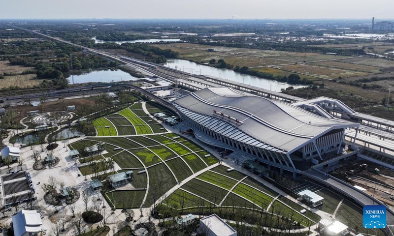 An aerial drone photo taken in Huzhou, east China's Zhejiang Province on Nov. 23, 2024 shows the bullet train No. G55505 entering Huzhou East Railway Station along a new high-speed rail line connecting Shanghai Municipality with the provinces of Jiangsu and Zhejiang in east China.  (Photo: Xinhua)