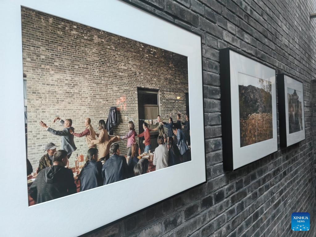 This photo taken on Sept. 19, 2024 shows photos hanging in the Domaine de Long Dai winery's hall in Penglai District of Yantai, east China's Shandong Province. (Xinhua/Shao Kun)