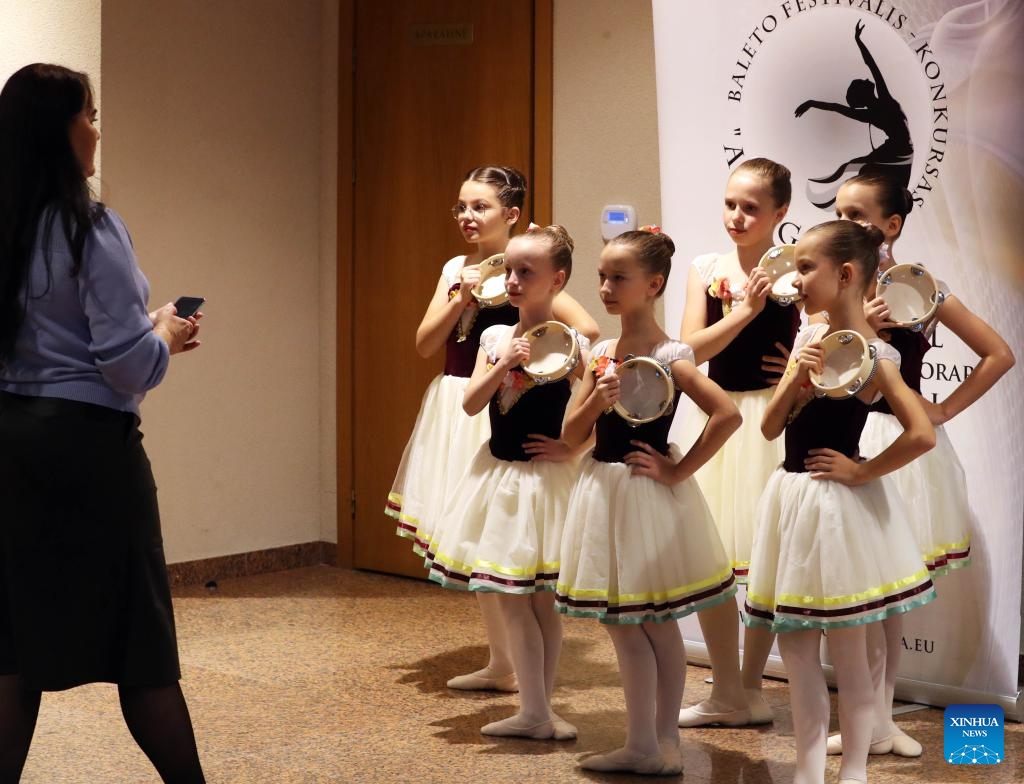 Performers get ready to perform for the international ballet and contemporary dance festival-competition ALLEGRO 2024 in Vilnius, Lithuania, on Nov. 23, 2024. Hundreds of dancers from Lithuania, Latvia and other countries will compete in the event held here from Nov. 23 to 24. (Photo by Yang Weihua/Xinhua)