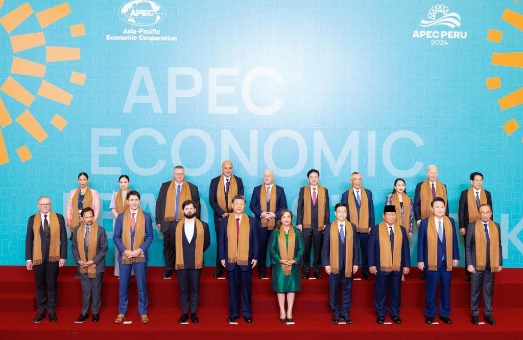 Chinese President Xi Jinping and other leaders and representatives from APEC member economies pose for a group photo in Lima, Peru, Nov. 16, 2024. Xi on Saturday delivered an important speech at the 31st APEC Economic Leaders' Meeting under the title Shouldering Responsibility to Our Times And Jointly Promoting Asia-Pacific Development. (Xinhua/Huang Jingwen)