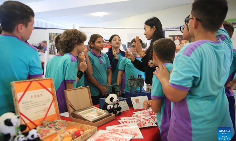 Students participate in interactive activities during the Confucius-themed photo exhibition in Qormi, Malta, on Nov. 22, 2024. (Xinhua/Chen Wenxian)