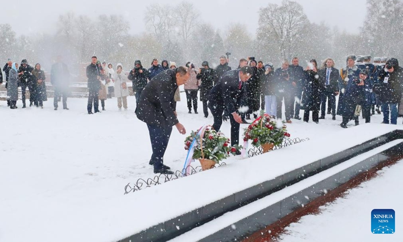 Belarusian Foreign Minister Maxim Ryzhenkov (R, front) and Russian Foreign Minister Sergei Lavrov (L, front) lay flowers at the Eternal Flame in the Brest Fortress in Brest, Belarus, Nov. 22, 2024. Lavrov and Ryzhenkov attended a meeting of the two countries' foreign ministries, during which the two sides formulated a joint action plan on unilateral coercive policies and sanctions against Belarus and Russia, and expressed a common position on the domestic and international political processes. (Photo by Henadz Zhinkov/Xinhua)