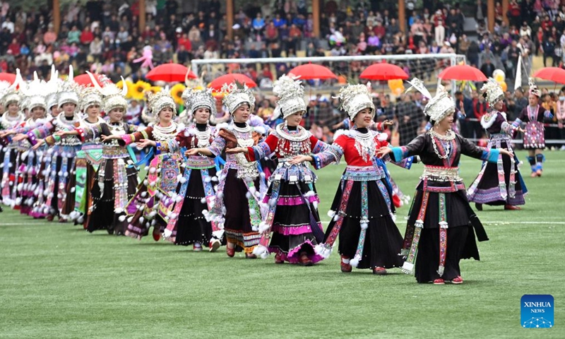 People in traditional costumes participate in Lusheng and horse fighting festival held in Rongshui Miao Autonomous County of Liuzhou, south China's Guangxi Zhuang Autonomous Region, Nov. 23, 2024. Lusheng is a folk musical instrument made of bamboo pipes. (Xinhua/Huang Xiaobang)