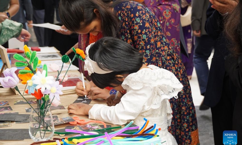 People take part in cultural activities during the Chinese Culture Night event in Dhaka, Bangladesh on Nov. 22, 2024. The Chinese Culture Night event organized by the Chinese Embassy in Bangladesh was held here Friday to showcase traditional Chinese culture and enhance the friendship between the two countries. (Xinhua)