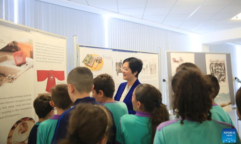 Students visit the Confucius-themed photo exhibition in Qormi, Malta, on Nov. 22, 2024. (Xinhua/Chen Wenxian)