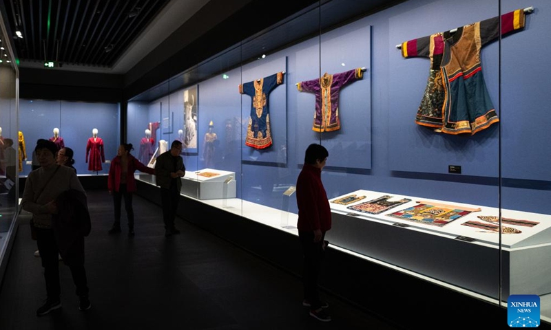 People visit an exhibition titled Cocoon of Traditions: Silk in the National Cultures of Eurasia at Hubei Provincial Museum in Wuhan, central China's Hubei Province, Nov. 22, 2024. The exhibition, which opened here on Nov. 22, showcases 283 pieces of silk textiles dating back from the 19th century to the first half of the 20th century from the Russian Museum of Ethnography. (Xinhua/Xiao Yijiu)