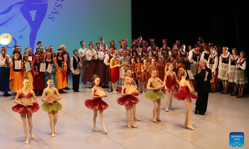 Performers receive awards during the international ballet and contemporary dance festival-competition ALLEGRO 2024 in Vilnius, Lithuania, on Nov. 23, 2024. Hundreds of dancers from Lithuania, Latvia and other countries will compete in the event held here from Nov. 23 to 24. (Photo by Yang Weihua/Xinhua)