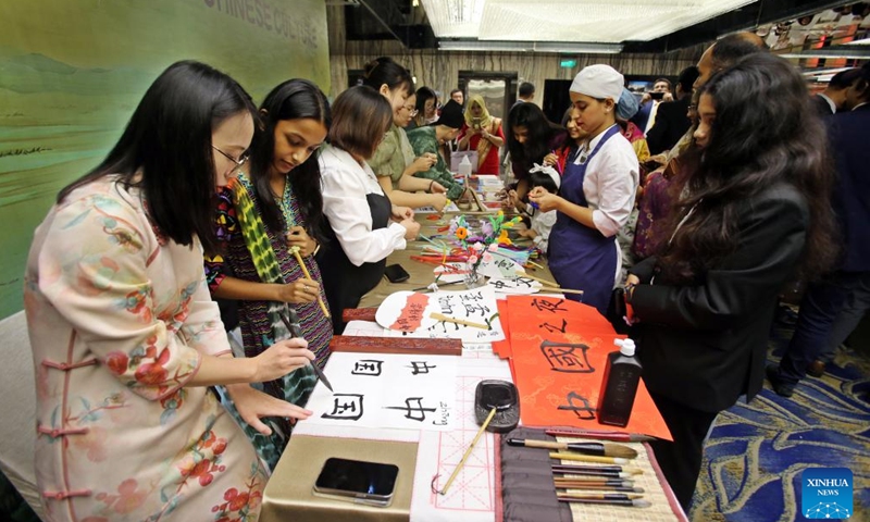 People take part in cultural activities during the Chinese Culture Night event in Dhaka, Bangladesh on Nov. 22, 2024. The Chinese Culture Night event organized by the Chinese Embassy in Bangladesh was held here Friday to showcase traditional Chinese culture and enhance the friendship between the two countries. (Xinhua)