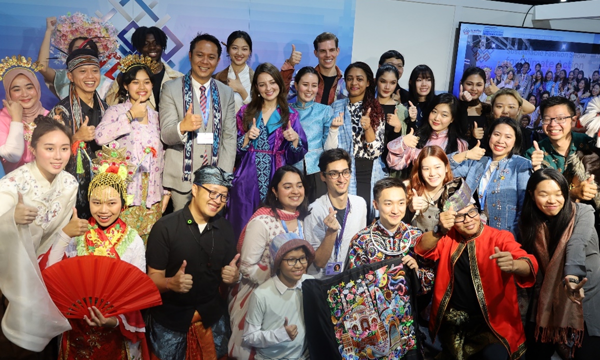 Young representatives from different countries wearing traditional outfits pose for a photo during the COP29 in Baku, Azerbaijan.
Photo: Courtesy of GAUC