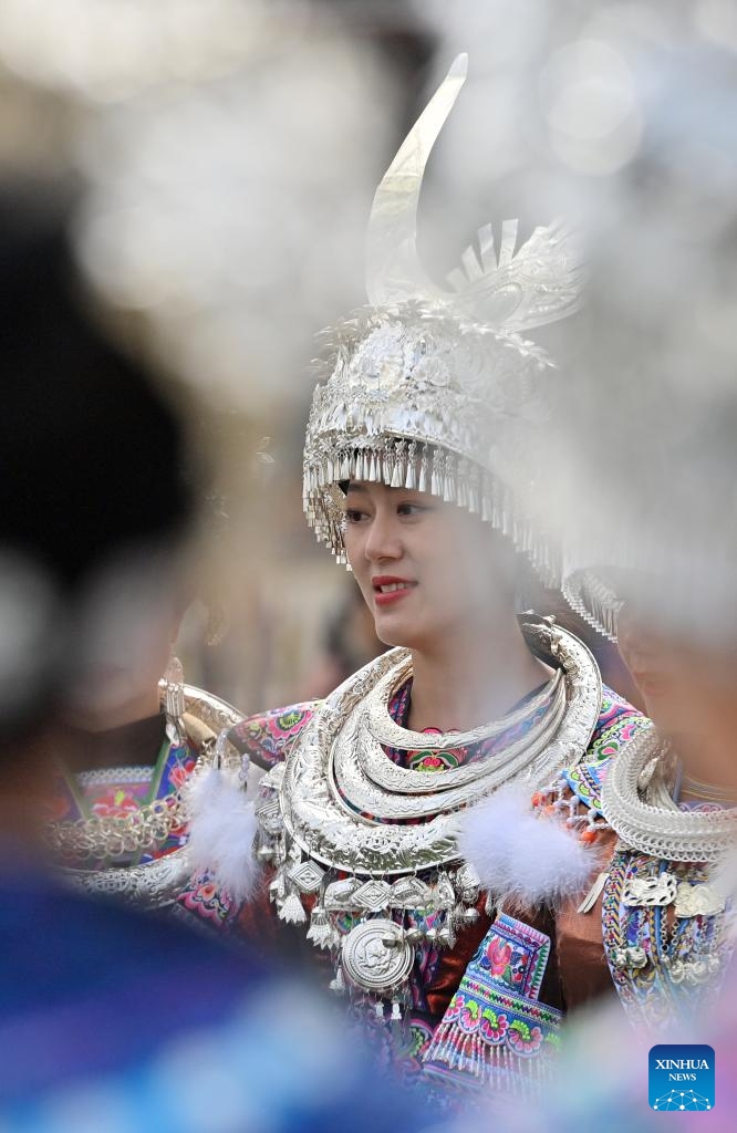 People in traditional costumes participate in Lusheng and horse fighting festival held in Rongshui Miao Autonomous County of Liuzhou, south China's Guangxi Zhuang Autonomous Region, Nov. 23, 2024. Lusheng is a folk musical instrument made of bamboo pipes. (Xinhua/Huang Xiaobang)