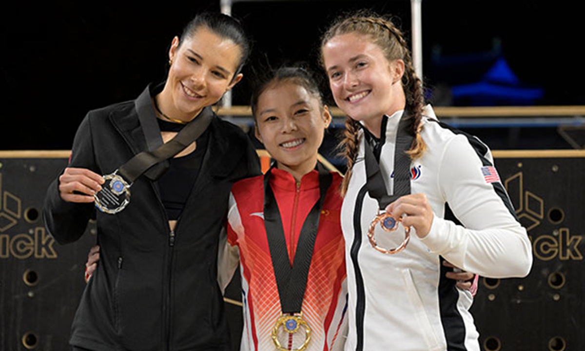 Gold medalist Shang Chunsong (center) poses on the podium at the FIG Parkour World Championships in Kitakyushu, Japan on November 17, 2024. Photo: Courtesy of FIG 