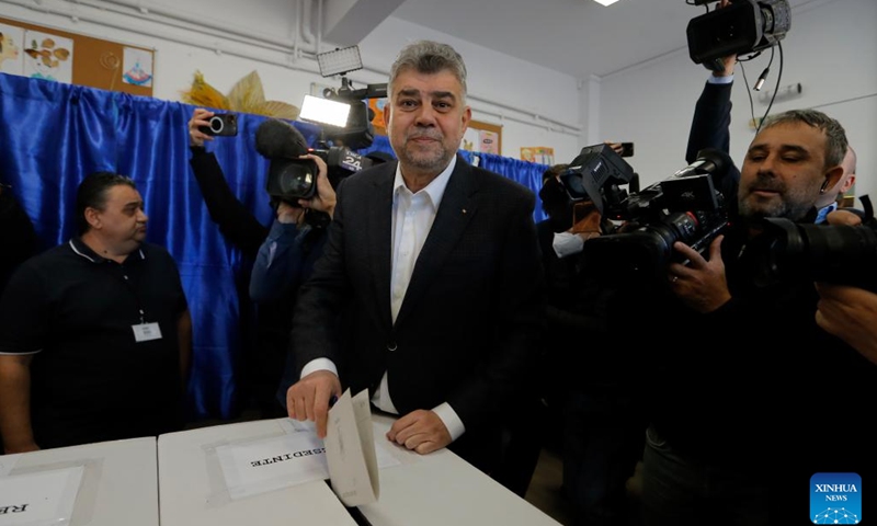 Romania's Prime Minister Marcel Ciolacu (C) votes during the first round of the presidential elections at a polling station in Bucharest, Romania, Nov. 24, 2024. Romanians headed to the polls Sunday for the first round of the presidential election, choosing from 14 candidates to lead the country for the next five years. (Photo by Cristian Cristel/Xinhua)