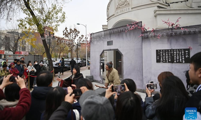 Actors perform drama the Phoenix hair clip in a street in Tianjin, north China, Nov. 24, 2024.(Xinhua/Li Ran)