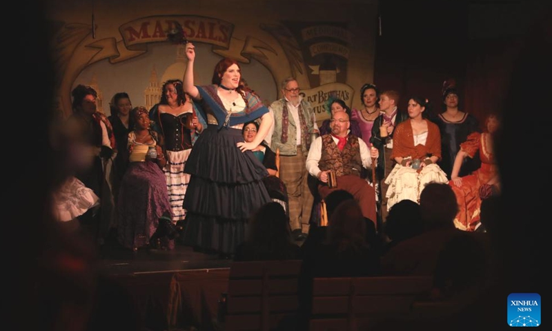 People wearing costumes of the Victorian era take part in the Great Dickens Christmas Fair in San Francisco, the United States, Nov. 23, 2024. The Great Dickens Christmas Fair, which was first held in 1970, opened in San Francisco on Saturday. The fair is aimed at attracting people to enjoy the culture of the Victorian era by recalling the characters and scenes in the works of British novelist Charles Dickens. (Photo by Liu Yilin/Xinhua)