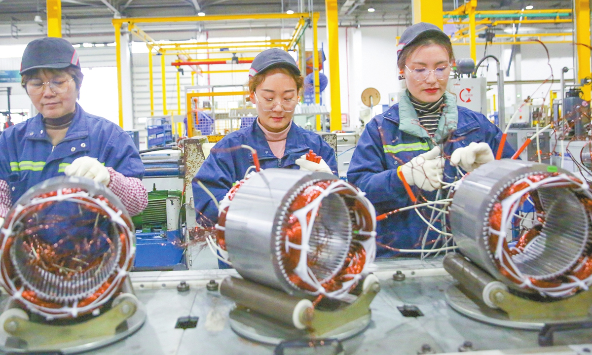 Workers rush to make orders for electrical motors for export overseas in a factory in Nantong, East China's Jiangsu Province on November 25, 2024. Chinese manufacturers are increasingly looking beyond the domestic market. With immense global potential, these companies are capitalizing on export opportunities to increase sales. Photo: VCG