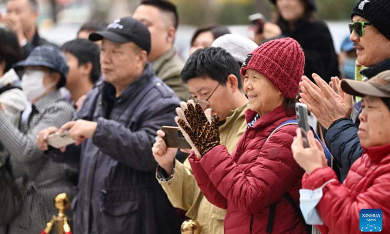 Audience watch drama the Phoenix hair clip staged in a street in Tianjin, north China, Nov. 24, 2024.