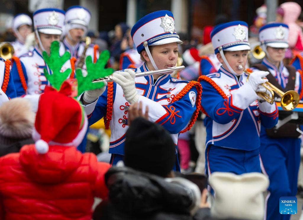 A marching band performs during the 2024 Toronto Santa Claus Parade in Toronto, Canada, on Nov. 24, 2024. (Photo by Zou Zheng/Xinhua)