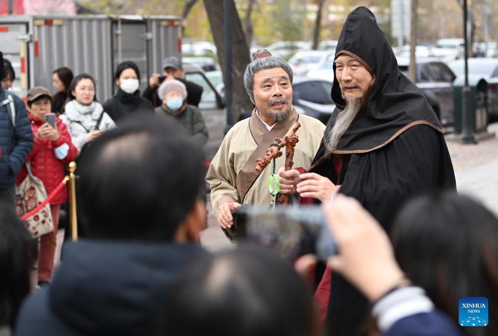 Actors perform drama the Phoenix hair clip in a street in Tianjin, north China, Nov. 24, 2024. 