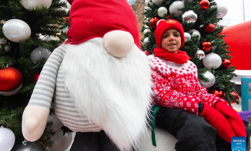 A child is seen on a float during the 2024 Toronto Santa Claus Parade in Toronto, Canada, on Nov. 24, 2024. (Photo by Zou Zheng/Xinhua)