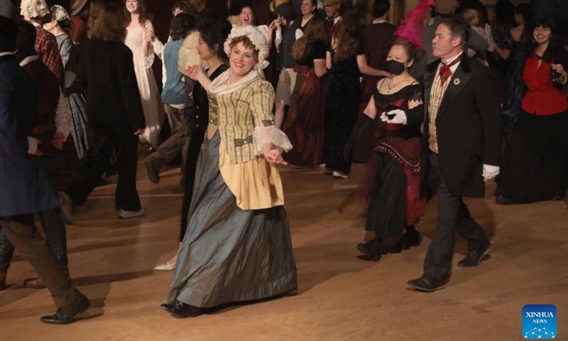 People wearing costumes of the Victorian era take part in the Great Dickens Christmas Fair in San Francisco, the United States, Nov. 23, 2024. The Great Dickens Christmas Fair, which was first held in 1970, opened in San Francisco on Saturday. The fair is aimed at attracting people to enjoy the culture of the Victorian era by recalling the characters and scenes in the works of British novelist Charles Dickens. (Photo by Liu Yilin/Xinhua)