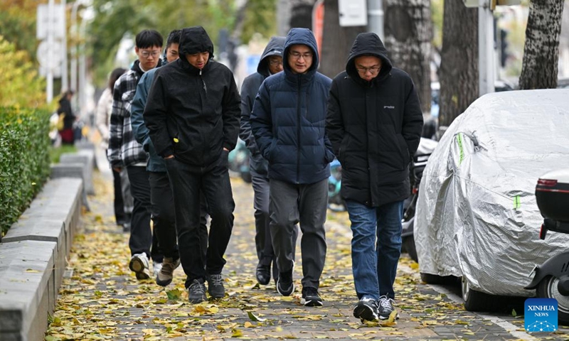 Pedestrians walk on a street in Beijing, capital of China, Nov. 25, 2024. (Photo: Xinhua)