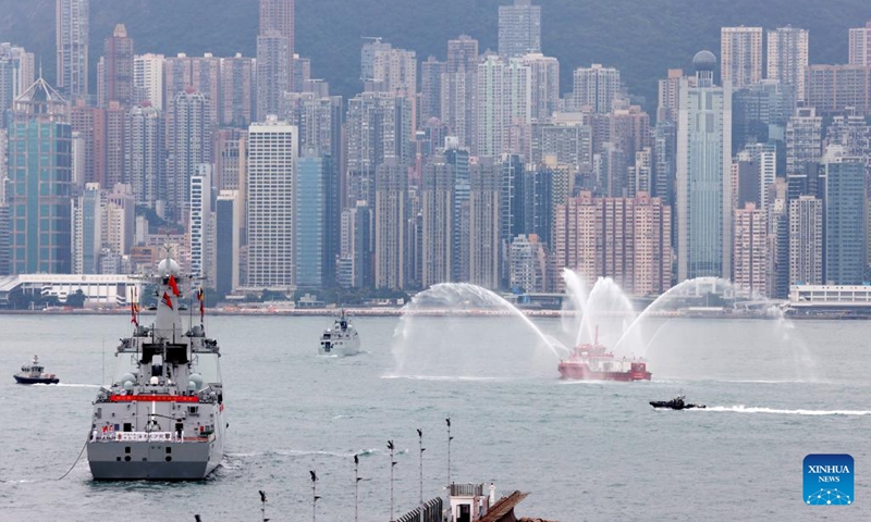 A fireboat of the Hong Kong Special Administrative Region government performs a water gate ceremony for the Chinese People's Liberation Army Navy fleet in Hong Kong, south China, Nov. 25, 2024. A Chinese People's Liberation Army Navy fleet comprising the Hainan amphibious assault ship and the Changsha missile destroyer visited Hong Kong from Nov. 21 to 25. (Photo: Xinhua)