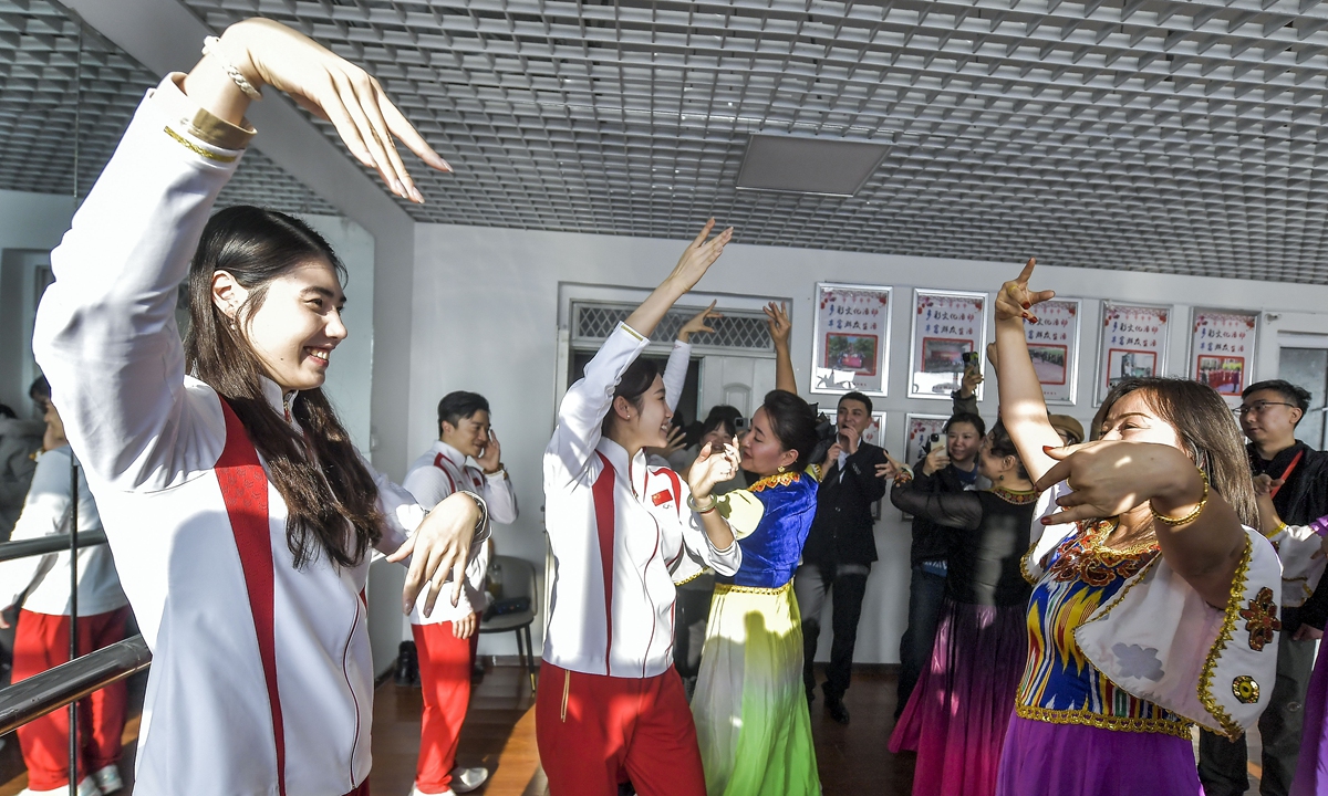 Chinese Olympic champions dance with local people in Urumqi, Northwest China's Xinjiang Uygur Autonomous Region on November 26, 2024. Photo:VCG