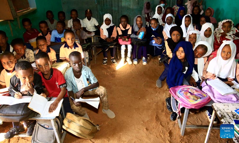 Children attend a class at a school in Al-Iskan, north of Omdurman, Sudan, on Nov. 25, 2024. More than 15 million children in Sudan are out of school due to the country's ongoing conflict. In relatively safe areas of Omdurman, some schools resumed classes on Monday.(Photo: Xinhua)