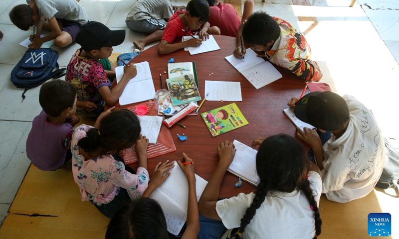 Street kids study at a monastery compound in Yangon, Myanmar, Nov. 24, 2024. (Photo: Xinhua)