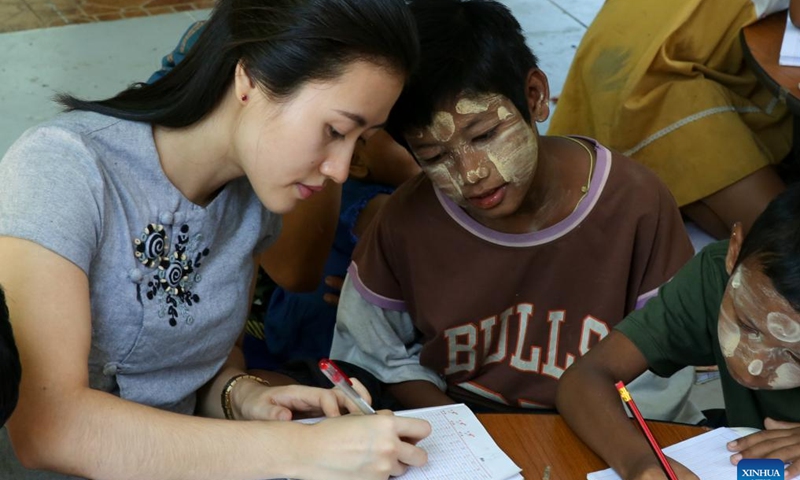 A local teacher tutors street kids at a monastery compound in Yangon, Myanmar, Nov. 24, 2024. (Photo: Xinhua)