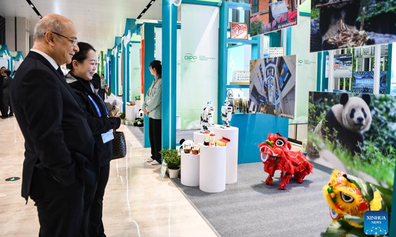 Guests watch a lion dance performed by robots during the Global Panda Partners 2024 conference in Chengdu, southwest China's Sichuan Province, Nov. 26, 2024. The event opened here on Tuesday with the theme Harmonious Coexistence Between Man and Nature. (Photo: Xinhua)