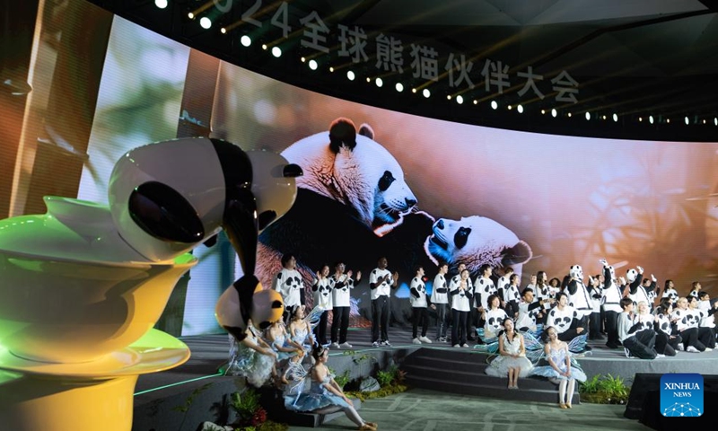 Performers stage a chorus during the Global Panda Partners 2024 conference in Chengdu, southwest China's Sichuan Province, Nov. 26, 2024. The event opened here on Tuesday with the theme Harmonious Coexistence Between Man and Nature. (Photo: Xinhua)