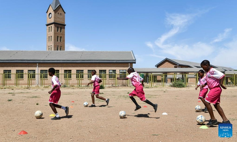 Students play football at China-aided Mmopane Primary School in Mmopane, Kweneng District, Botswana, Nov. 4, 2024. (Photo: Xinhua)