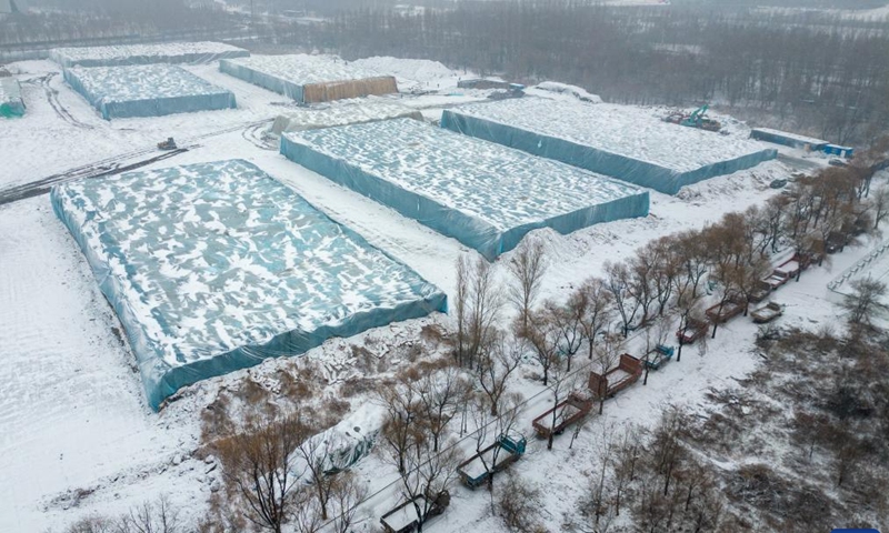 An aerial drone photo shows trucks queuing up to transport ice cubes to be used in the construction of the 26th Harbin Ice-Snow World in Harbin, northeast China's Heilongjiang Province, Nov. 26, 2024. (Photo: Xinhua)