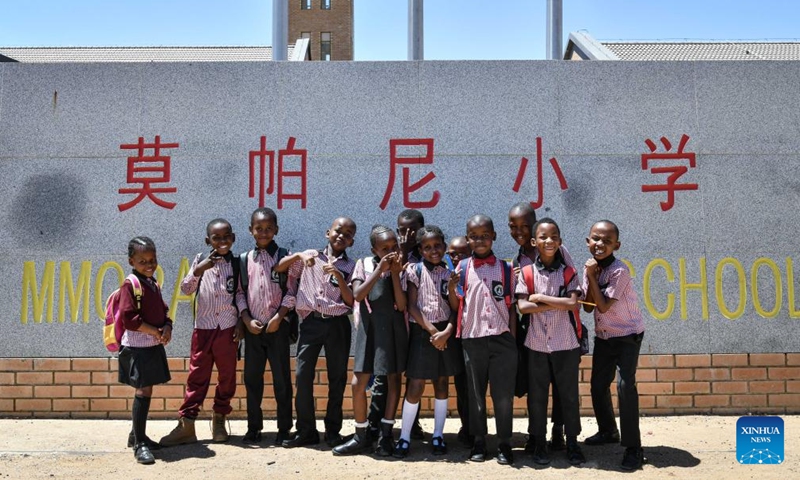 Students pose for a group photo at the gate of China-aided Mmopane Primary School in Mmopane, Kweneng District, Botswana, Nov. 4, 2024. (Photo: Xinhua)