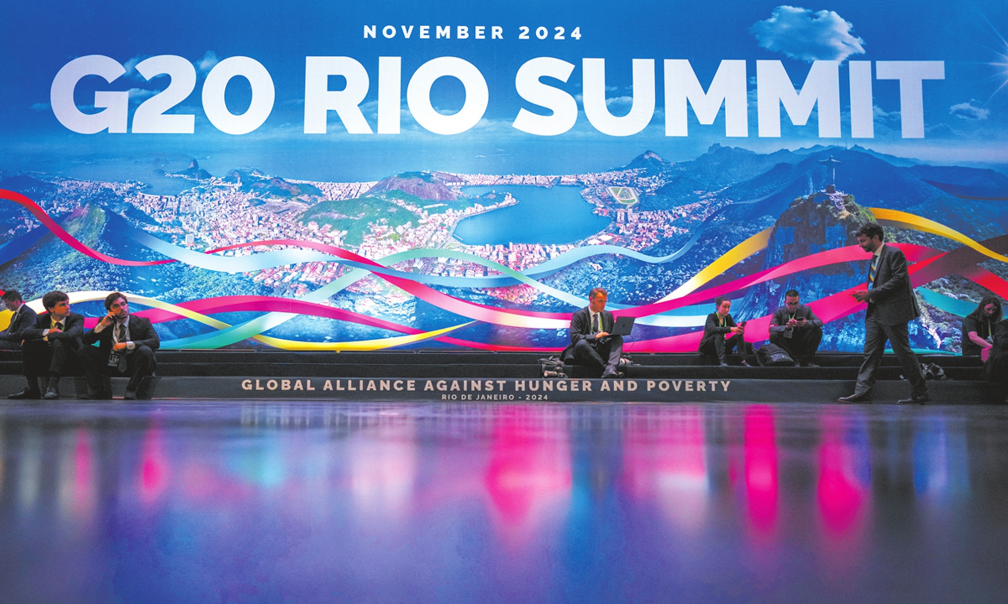 Participants sit in front of the G20 Summit logo on November 18, 2024 in Rio De Janeiro, Brazil. Photo: VCG