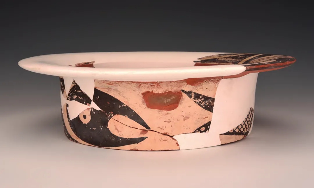 A rare painted pottery fish-pattern basin from the Yangshao Culture period was discovered at a pit in Cuijiahe village, North China's Shanxi Province. Photo: Courtesy of Shanxi Provincial Institute of Archaeology