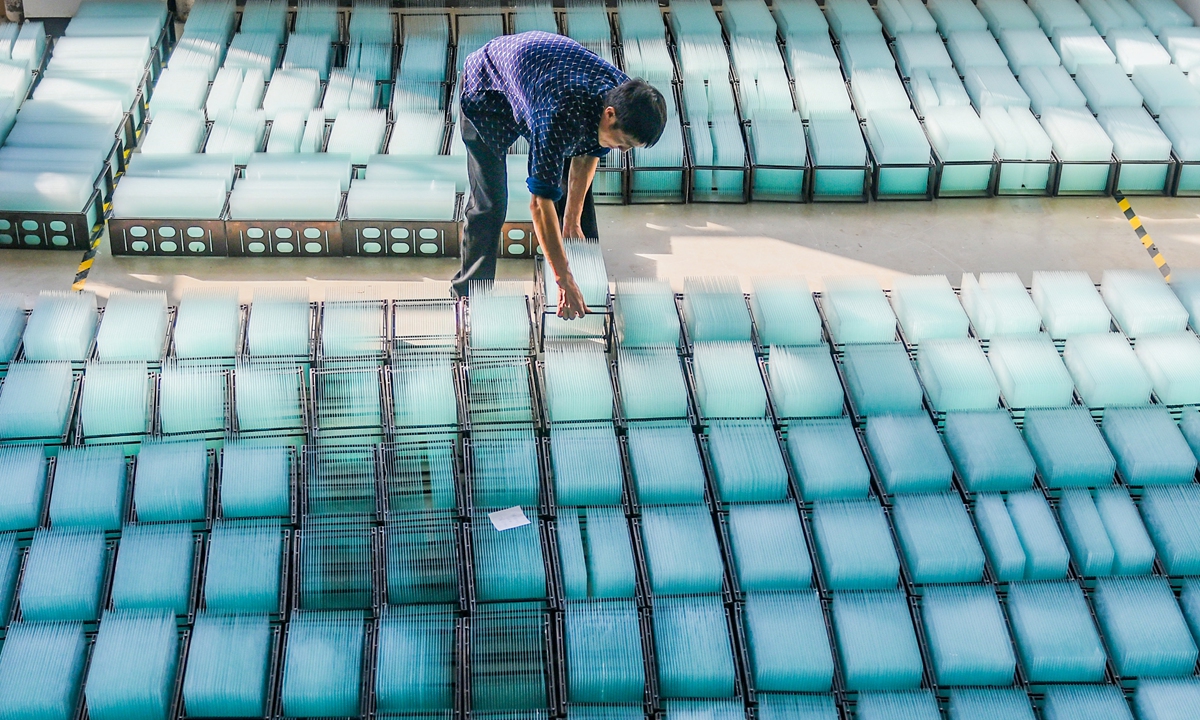 A member of staff works at a factory producing touchscreen glass panels in Yongzhou city, Central China's Hunan Province, on November 29, 2024. In the first 10 months of 2024, China exported 1.56 billion LCD panels, up 12.3 percent year-on-year. Photo: VCG