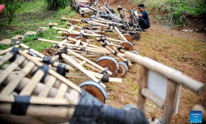 Traditional wooden carts, known locally as kadaplak, are seen before a race at Cisurupan in Bandung, West Java Province, Indonesia, Nov. 28, 2024. (Photo by Septianjar Muharam/Xinhua)