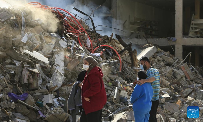 (241129) -- TYRE, Nov. 29, 2024 (Xinhua) -- Lebanese returnees are seen among rubble in Tyre, Lebanon, on Nov. 28, 2024. (Photo: Xinhua)