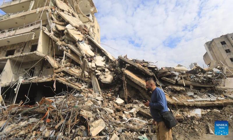 A Lebanese returnee is seen in front of a ruined building in Nabatieh, Lebanon, on Nov. 28, 2024. (Photo: Xinhua)