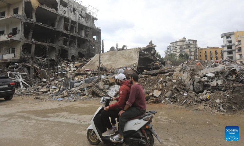 Lebanese returnees ride a motorcycle in Nabatieh, Lebanon, on Nov. 28, 2024. (Photo: Xinhua)